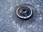 Pond heater in the ice.